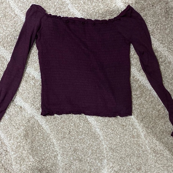 Purple tank top longs sleeve. Never worn.
